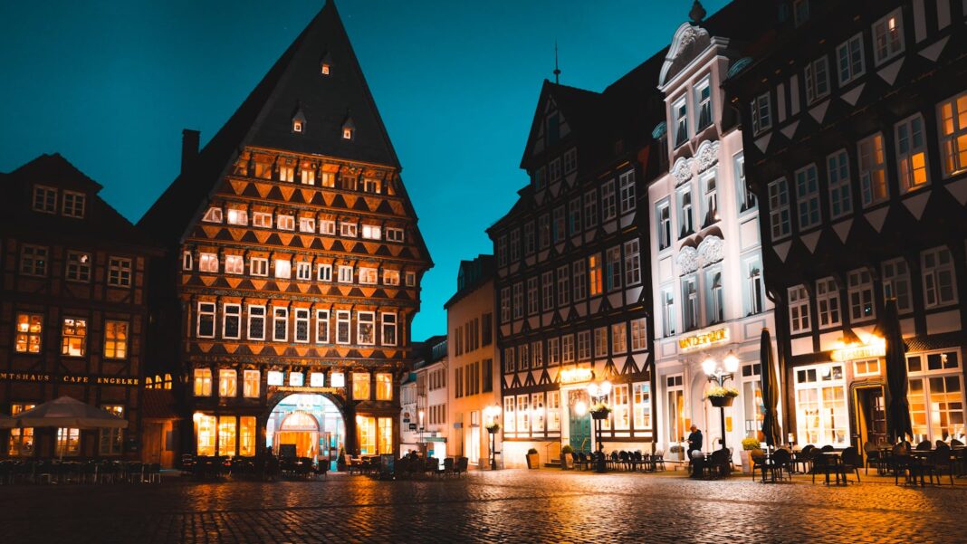 Beautifully illuminated evening scene in Hildesheim, Germany showcasing historical architecture.
